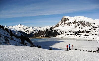 View of the partly frozen lake and blue skies
