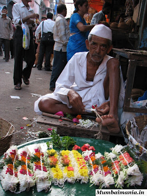 old man making garlands old man making garlands