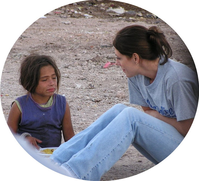 Valerie with a child in the city dump, Tegucigalpa, Honduras