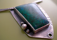sterling and parrot wing pendant by metalsmith janice fowler
