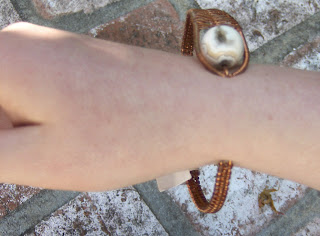 Slip across narrowest part of wrist