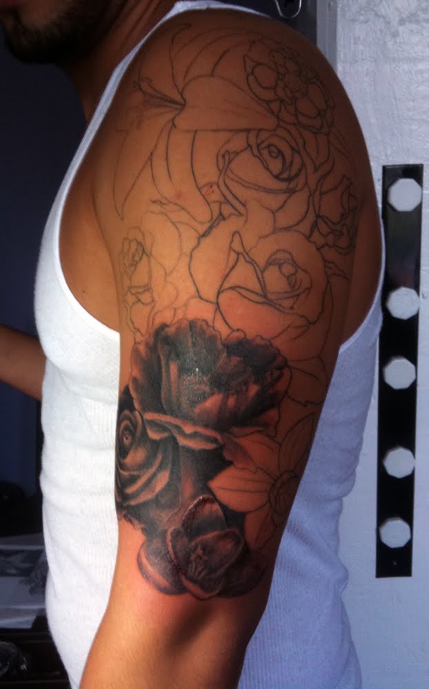 mid tattoo session sleeve floral second grey