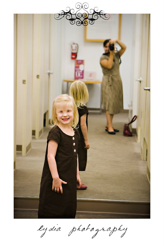Little girl at the mirror at lifestyle kids portraits in San Antonio, Texas