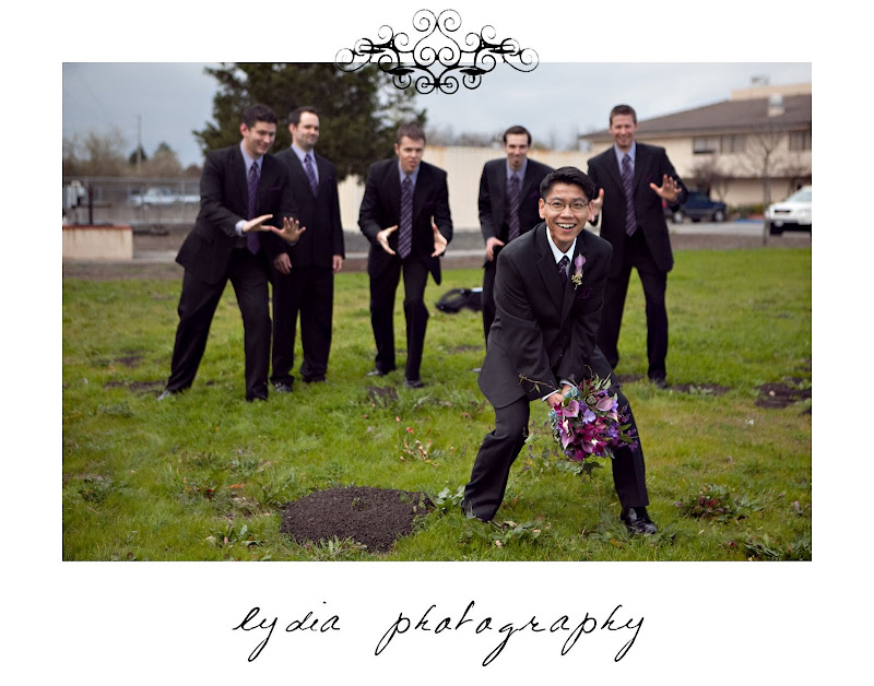Groom throwing the bouquet at groomsmen at purple, winter wedding in Santa Rosa, California