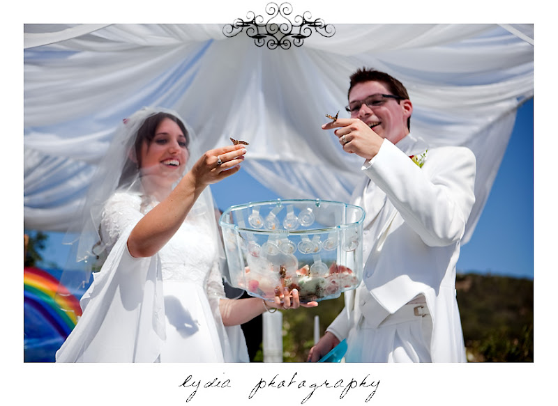 Rosemary and Jared releasing butterflies during the wedding in Santa Rosa California