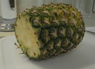 Cut the top and bottom off the pineapple