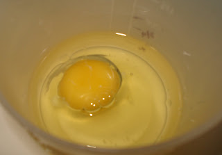 Add egg to oil