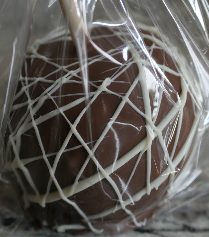 Delicious Apple covered dipped in Dark Chocolate with White Chocolate Drizzle