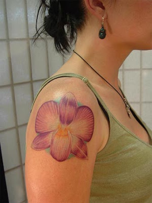 Beautiful orchid flower tattoo engraved on the feet using nice colors. Phoenix Bird With Orchid Flower Tattoo. The meanings of orchids are very Beautiful orchid flower tattoo engraved on the feet using nice colors. Phoenix Bird With Orchid Flower Tattoo. The meanings of orchids are very