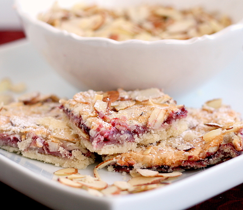 Raspberry Almond Bars Sprinkled with Flour