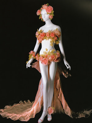 This daring flora inspired wedding gown made of silk flowers with a pink This daring flora inspired wedding gown made of silk flowers with a pink