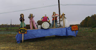 scarecrows on platform