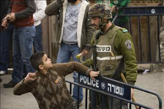 A brave young boy stands up to his occupier.