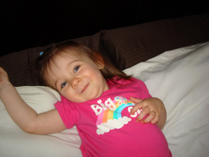 Oh Hi!! I love laying on Daddy's side of the bed