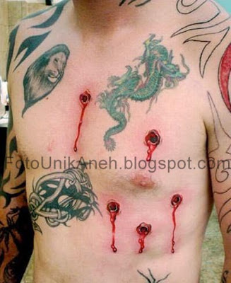 Tato Mirip Lubang Tembakkan