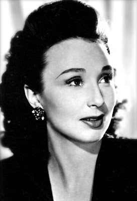 Googie Withers with an odd face for film but all the right moves.