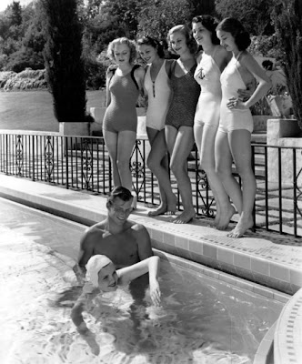 Buster Crabbe gives a swim lesson. Buster Crabbe