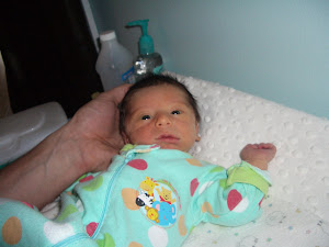 Mom's hand with baby's head!