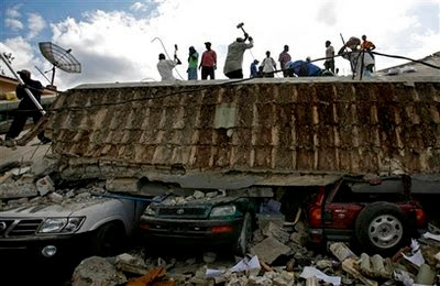 People search for survivors under the rubble of a collapse building.