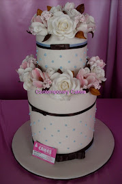 Triple tier base and double tier top with sugar roses and  tulips