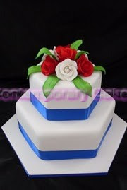 Hexagon stacked cake with sugar roses.