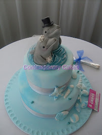 Beach theme with sugar paste dolphin toppers