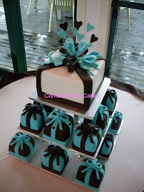 Teal blue and chocolate miniature bow cakes.