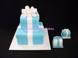 Tiffany 2 tier stacked cake with miniature cakes.