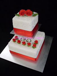 2 tiered pillared sugar roses cake.