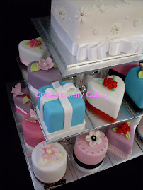 Miniature wedding cakes, heart, round and square shaped.