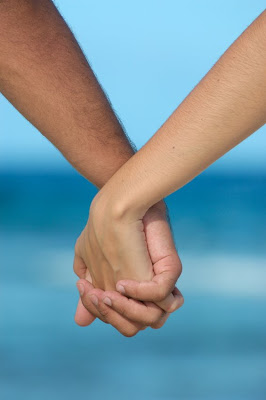 HOLDING HANDS.