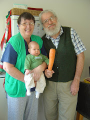 Owen with Durban Granny & Grandpa & the big carrot