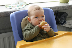 Owen getting his mouth around a pear