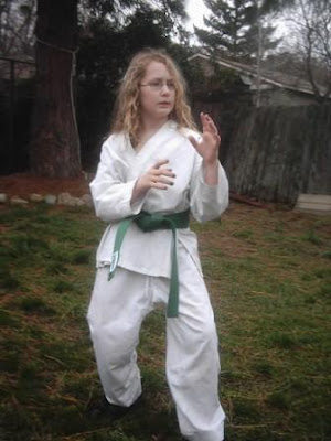 Baylin Stich levels up to green belt in karate.