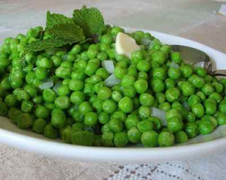 English peas with sprigs of fresh mint