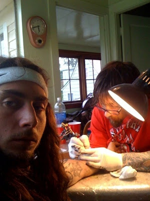 Here's pro snowboarder Danny Kass getting tattooed by pro snowboarder Jamie Here's pro snowboarder Danny Kass getting tattooed by pro snowboarder Jamie