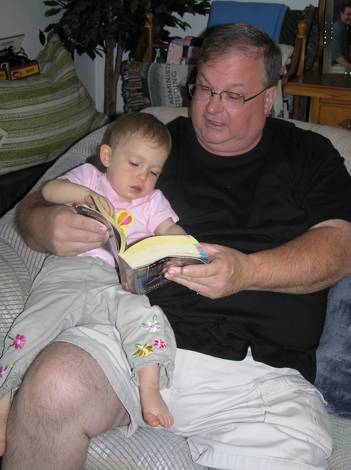 [20090905+006+Emily+reading+the+phone+book+with+Grandpa.JPG]