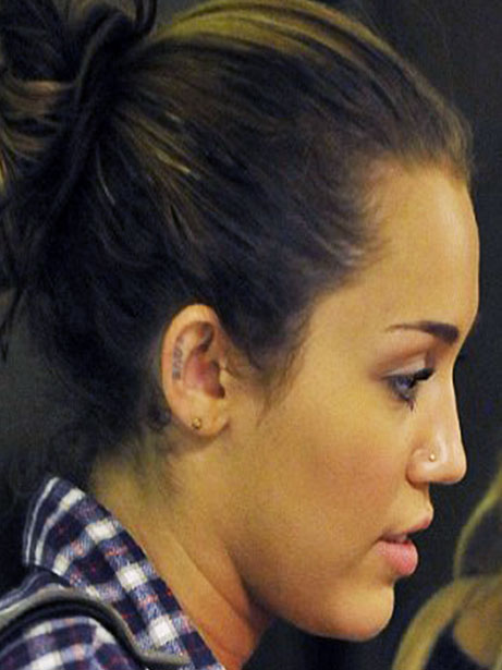 miley cyrus tattoo. Miley cyrus new ear tattoo