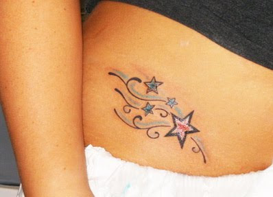 star tattoo design on rib