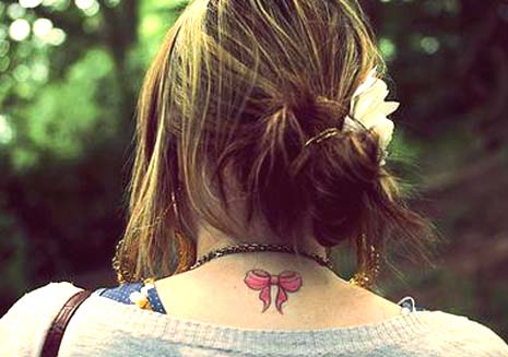 pink bow tattoos Every colored ribbon has different symbols so make sure