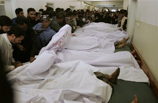 http://4.bp.blogspot.com/_QfVWU-2pVL4/S2wwMilfa7I/AAAAAAAAL94/Pqjv2qwGzqo/s640/People+look+at+dead+bodies+of+bomb+blast+victims+at+a+local+hospital+in+Karachi,+Pakistan,+on+Friday,+Feb.+5,+2010.+A+bomb+tore+through+a+bus+carrying+Shiite+Muslim+worshippers..jpg