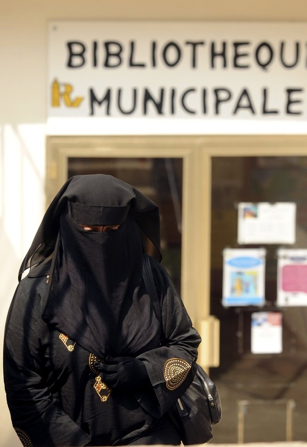 [woman+wears+a+burqa+as+she+ indonesian women clothing. [woman+wears+a+burqa+as+she+