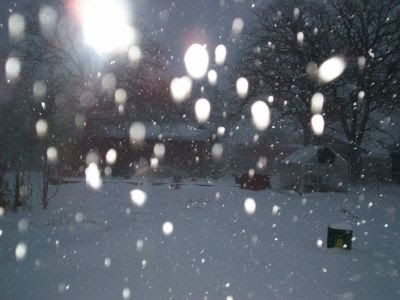 Snow storm behind cabin