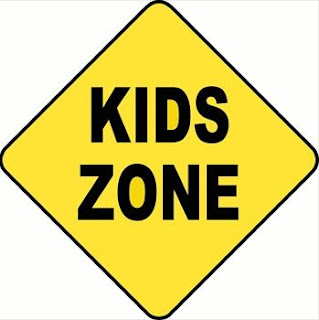 Caution sign that says kid zone