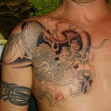 Don't get Japanese Dragon Tattoos until you read this. After reading this short article, you will be more well informed and able to make a better choice when selecting your Design. Let's begin. The dragon has long been an important symbol in Japanese mythology. The Japanese dragon is a fascinating creature with the head of a camel, eyes of a hare, horns of a deer, scales of a carp, paws of a tiger, and claws of an eagle. Additionally, Japanese dragons also commonly have long whiskers and a jewel under its chin. Many people are attracted to the allure of these mystical creatures, but few people truly know what they symbolize. Japanese dragons, like their Chinese counterparts, are distinct from Western dragons. Whereas in Western culture they are depicted as evil and malevolent, dragons in Japanese Mythology are viewed as guardians of the imperial families. For this reason, many people chose the Japanese dragon to serve as a guardian and protector. In Japan, a dragon is normally called