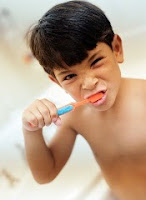 Kid brushing teeth
