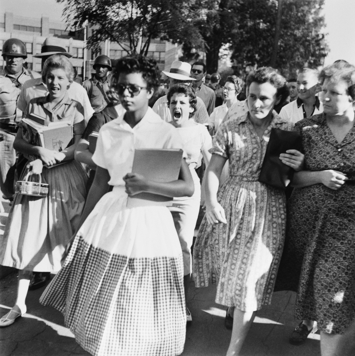 [Elizabeth+Eckford+ignores+the+hostile+screams+and+stares+of+fellow+students+on+her+first+day+of+school.++She+was+one+of+the+nine+negro+students+whose+integration+into+Little+Rock's+Central+High+School.jpg]