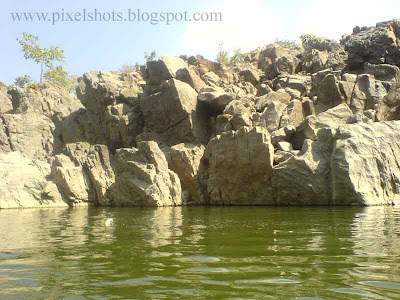 rocks on river bank of kauveri river in hoganekkal photographed during tour trip