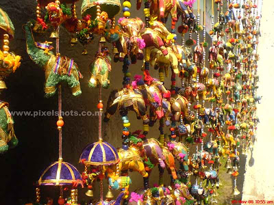 elephant toys in the front of a street shop from the oldest jew street in india at cochin kerala,decoratives,decoration toys,house decorations,cheap toys,street side shop decoratives,cochin,kerala