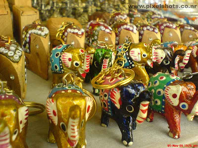 closeup photograph of toys of elephants keychains from street side fancy shop in cochin kerala